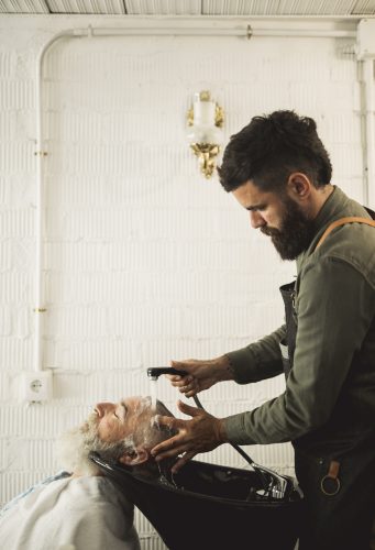 adult-barber-washing-old-man-hair-backwash